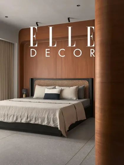 Featured in Elle Decor, this bedroom is celebrated for its blend of retro style and Japandi principles. The wood panelling and custom furniture create a space that is both peaceful and full of personality.