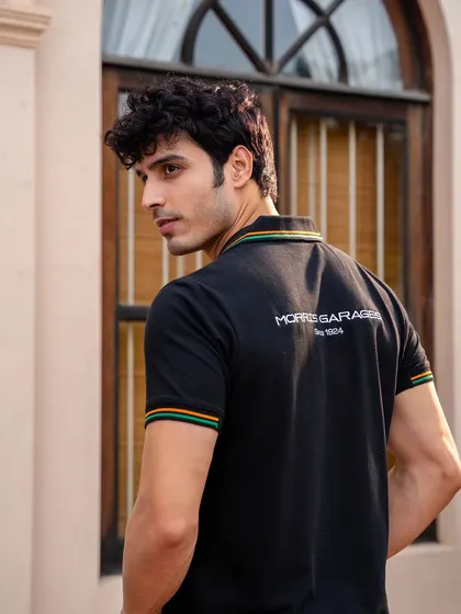 Another angle of the MG Motor polo, showing the branding on the back and sleeve. This provides a comprehensive view of the product for online shoppers.
