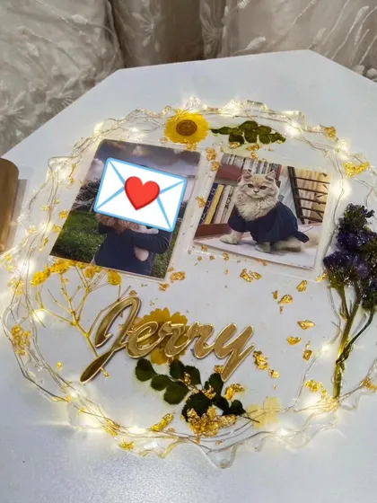 The 'Jerry' pet memorial frame with fairy lights turned on. The lights add a warm glow and make the piece feel even more special.