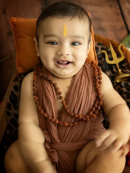 A bright, engaging smile that lights up the frame.