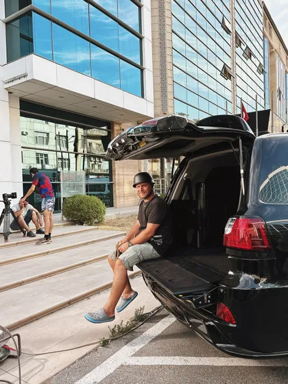 The reality of on-location shoots. We often have to get creative with our camera setups to capture the perfect angle.