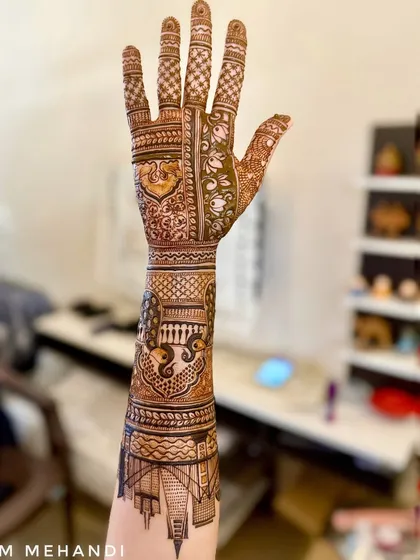 This design shows how we can blend modern ideas with traditional art. I combined a detailed cityscape of a place special to the client with classic Indian motifs like peacocks and jaali patterns, creating a full-arm design that is both personal and beautiful.