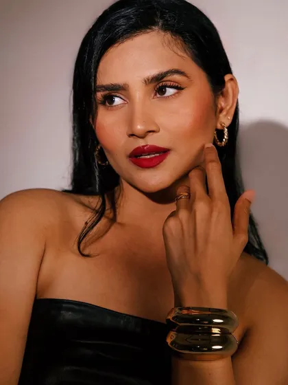 A classic beauty portrait showcasing the final look with the YSL Rouge Extravagance lipstick.