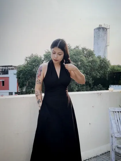 A quiet, thoughtful moment. This self-portrait captures the versatility of a simple black dress and the feeling of being at ease.