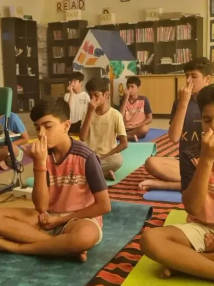 Football is a mental game too. Here, our players practice breathing exercises during a meditation session, building focus and resilience that they can take onto the pitch.