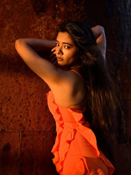 A dynamic over-the-shoulder pose with a captivating look back at the camera.