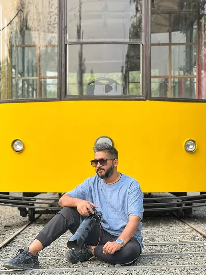 A moment of thought while sitting on the tracks, visualizing the final image.