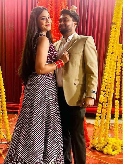 A playful and romantic shot of the couple at the wedding event.