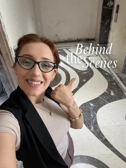 A behind-the-scenes selfie from a site visit. The custom black and white marble flooring is just being installed, and it's exciting to see the design vision start to come to life.