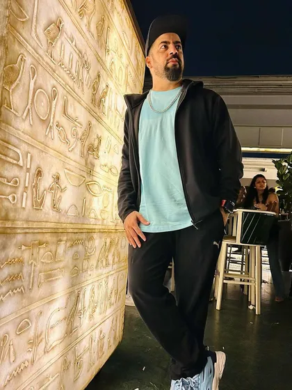Posing by the Egyptian-themed wall at Pangeo. The venue's aesthetic is truly unique.