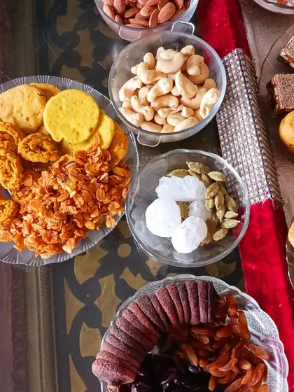 The dry fruits, nuts, and simple sweets that form an essential part of the 56 Bhog. This includes figs, dates, cashews, almonds, and chakli, all arranged for the festive offering.