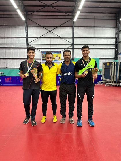 Celebrating with Akash K J and his doubles partner after their win at the All India Ranking Tournament.