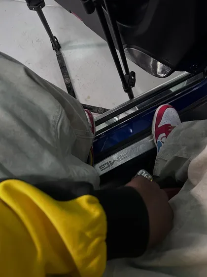A close-up on the kicks and the AMG door. It's about the details. The drip is part of the story, representing the success that comes from the hustle.