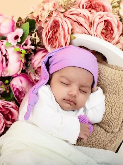 A vintage-themed newborn shoot, complete with a miniature gramophone and a bed of pink flowers. I love designing unique and detailed setups for my smallest clients.