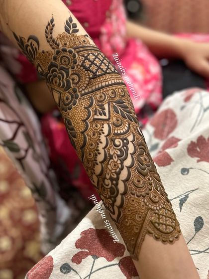 Another view of Afnaz's forearm, highlighting the beautiful contrast and flow of the Pakistani design.