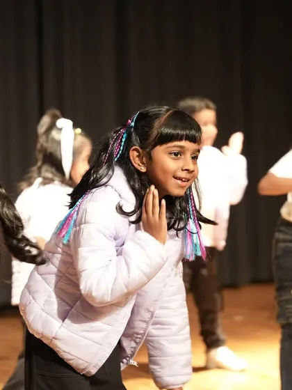 A behind-the-scenes moment just before hitting the stage. The preparation for performance night is filled with focused rehearsals, last-minute tweaks, and lots of team spirit.