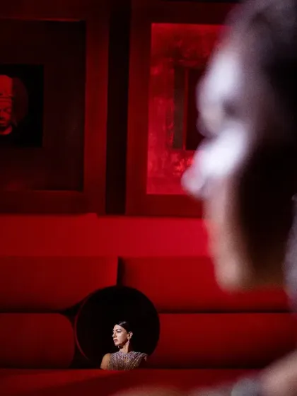 Another version of the creative sofa shot, this time with the bride in the frame, viewed from a distance. It creates a surreal, artistic narrative.