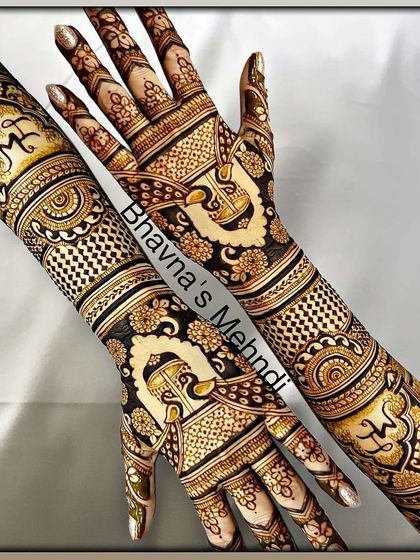 A beautiful example of symmetrical bridal mehndi, featuring elephants and other royal motifs for a grand wedding look.