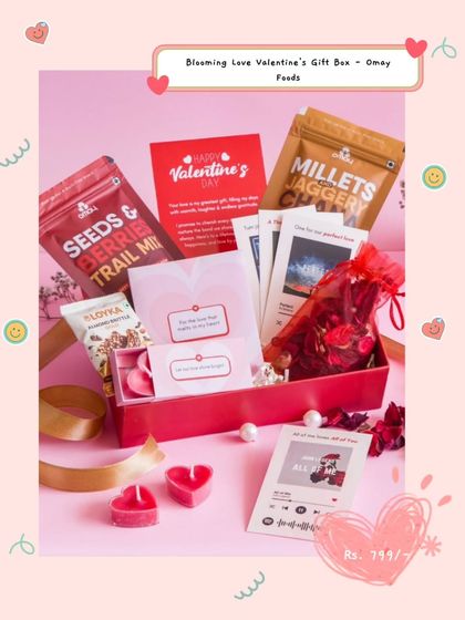 The Blooming Love Valentine's Gift Box is a healthy and romantic option. It includes a seeds and berries trail mix, heart-shaped candles, and a custom playlist card.