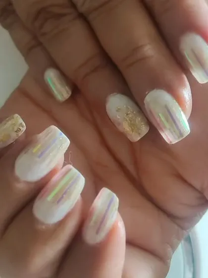 A closer look at the holographic shattered glass nail art. You can see how the foil strips catch the light differently from every angle.