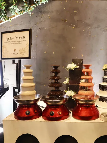 Opulent Desserts. A trio of chocolate fountains, in dark, white, and ruby chocolate, offers an interactive and indulgent experience for guests.