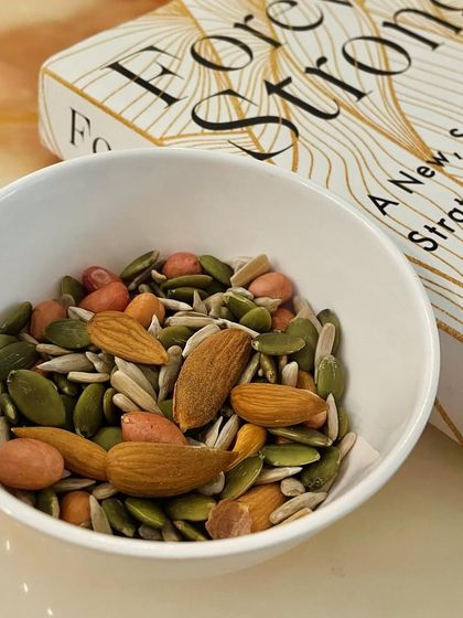 A handful of mixed nuts and seeds is a great snack to have when hunger strikes. It's rich in healthy fats, fiber, and micronutrients like zinc from pumpkin seeds. Plus, it's easy to carry with you anywhere.