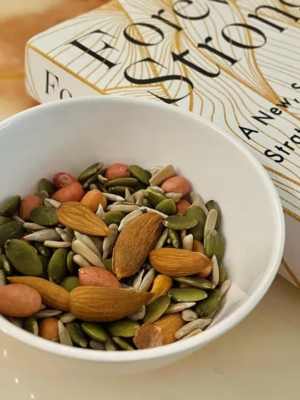 A handful of nuts and seeds is a great snack if you feel the urge between meals. It's rich in healthy fats, micronutrients, and fiber. Pumpkin seeds, in particular, are a great source of zinc for boosting immunity.