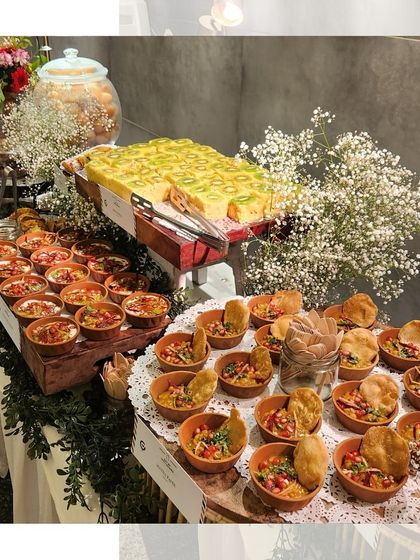 A "chatpata" grazing table featuring a variety of Indian street food snacks served in traditional earthen pots, perfect for a fun and flavourful event.
