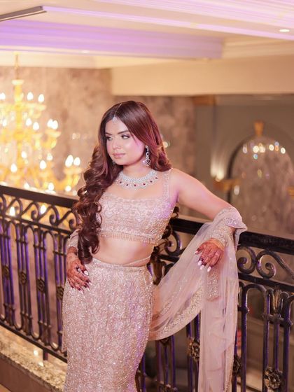 Another angle of my engagement outfit, showcasing the intricate details of the mermaid lehenga against the beautiful venue backdrop.