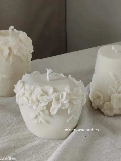 My floral pillar candles are a beautiful way to bring botanical elements into your decor. This image shows three different designs with 3D floral reliefs.