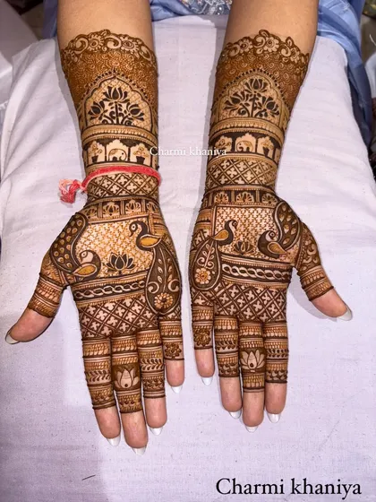 A special design for the groom's sister! This intricate mehendi is packed with traditional elements, including peacocks, elephants, and lotus flowers, fit for a royal celebration.