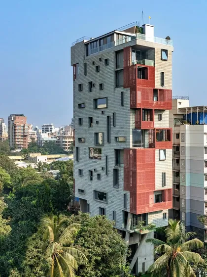 The J-House stands as a quiet counterpoint to the dense urban fabric of Mumbai. It is an exploration of vertical living that prioritizes natural light, ventilation, and a connection to the sky, using deep verandahs and screens to mediate the relationship with the city.