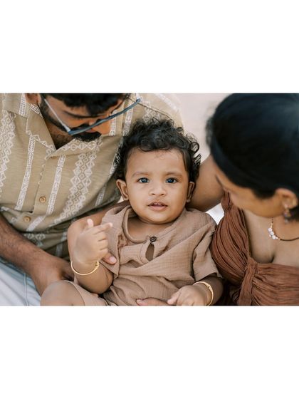 There's something magical about the beach. This family portrait captures the serene and beautiful atmosphere of a day by the sea.