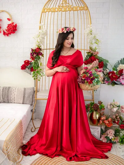 Bold and beautiful in a vibrant red satin gown. This dress has a classic, elegant feel, and the rich color makes a powerful statement. Here it is styled with a floral crown for a touch of softness.