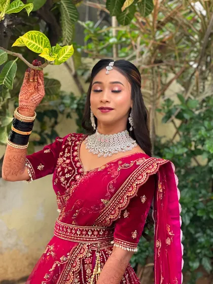 A serene shot with eyes closed, highlighting the beautiful eye makeup.