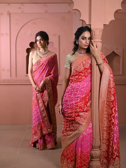A full view of the two models, showing how the same color family can be expressed in different textures and weaves, from bandhani to brocade.