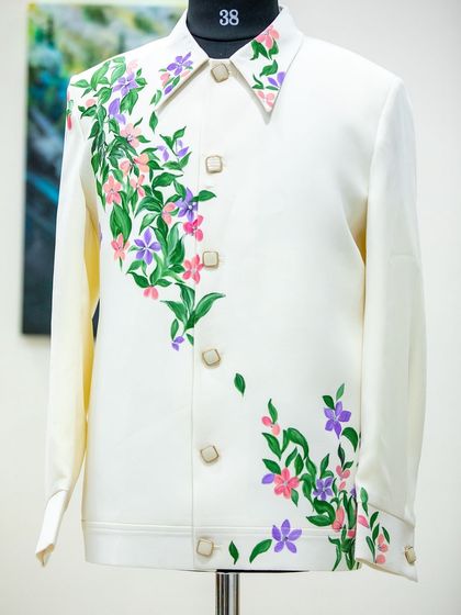 When fashion meets art, something beautiful is created. I painted these delicate florals on a Lachka suit, with the design cascading diagonally from the collar for an elegant, asymmetrical look.