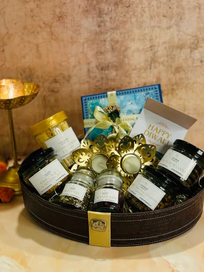 Another view of the 'Regal Affairs' Diwali hamper, highlighting the variety of jarred snacks and the elegant packaging.