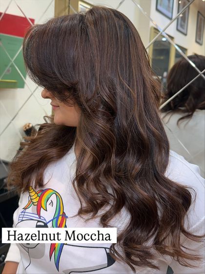 A close-up of the Hazelnut Mocha shade, showing the subtle highlights and beautiful, bouncy curls.