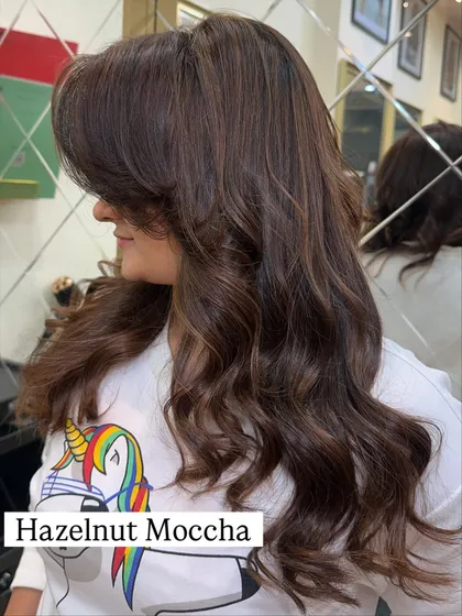 Hazelnut Mocha is a beautiful, subtle shade that adds warmth without being too bold. The side swept fringe and soft curls complete this elegant style.