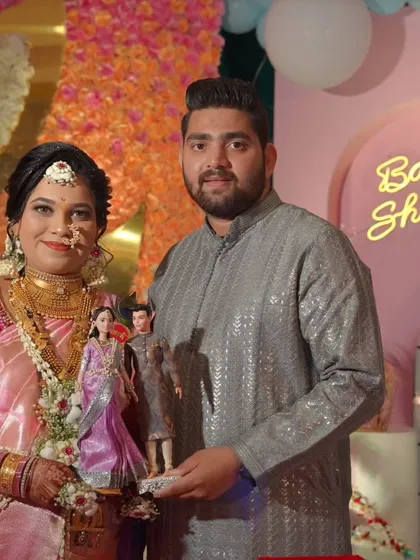 Another shot of the lovely couple with their personalized dolls, celebrating their *dohale jevan*.