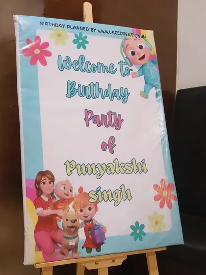A Cocomelon-themed welcome sign for Punyakshi's birthday party. We ensure every detail, from the entrance to the main stage, follows the chosen theme.