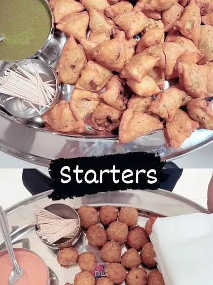 A combination of popular vegetarian starters. The top plate has mini samosas with green chutney, and the bottom plate has cheese balls with a creamy dip.
