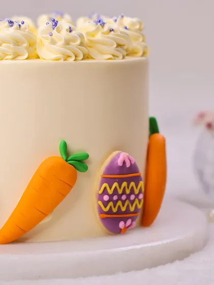 Another detail shot of the Easter cookie cake, showing the intricate patterns on the egg cookies.