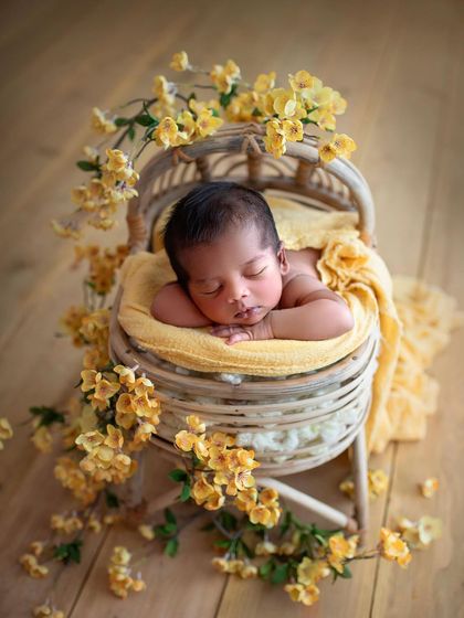 Another look at this handsome little man in the yellow floral setup. He looks like he's sleeping on a bed of sunshine.