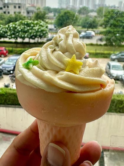 A close-up of my ice cream cone soap, one of my most popular artisanal designs. This one features a vanilla-colored scoop with tiny star sprinkles.