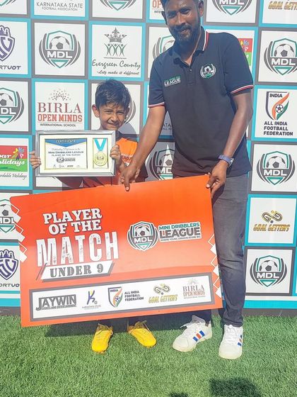 Our U9 player receiving his 'Player of the Match' award from the coach. These moments build confidence and motivate our young athletes to keep working hard.