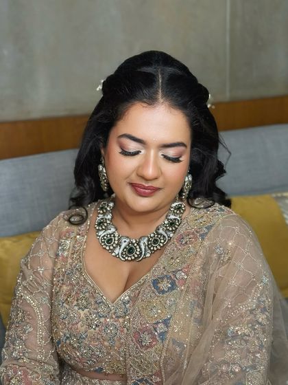 A close-up on her makeup, with a focus on the soft, shimmery eyes and flawless skin.