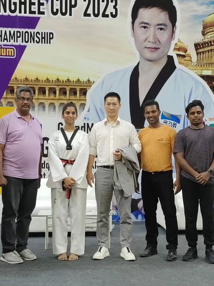 Our coaching staff with a Korean Grandmaster at an international event. We constantly seek to learn and improve our own skills to better serve our students.