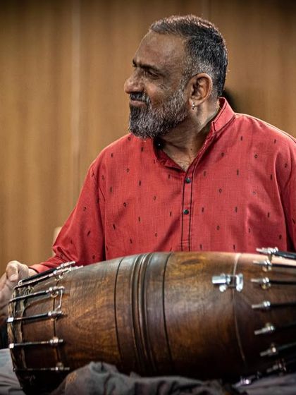 A duplicate of image 20, a close-up of Jayachandra Rao, a master of the mridangam. His powerful and precise playing provides the rhythmic drive for our traditional and fusion pieces.